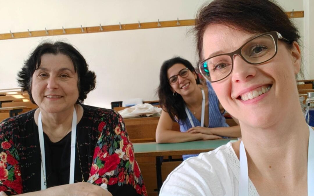 Three AECED colleagues, smiling, at ECER 2025