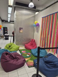 Area with bean bags, hoops and scarves - used by people to engage with movement or discussion