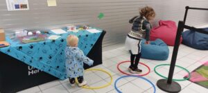 Siblings jump though hoops in a game so that both were included